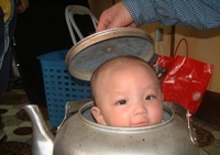 397baby-head-in-kettle